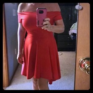 Red dress off shoulders. Longer in back